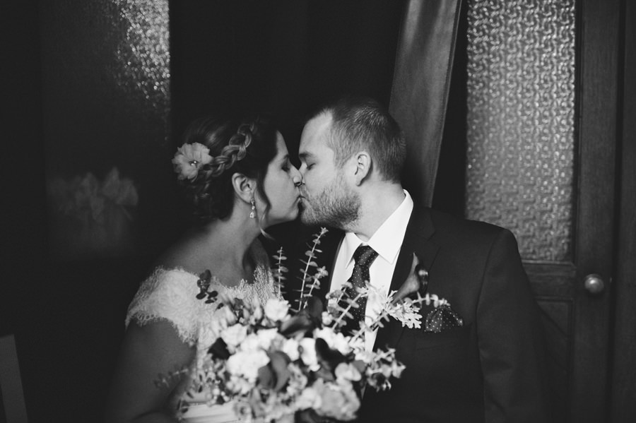 bride and groom kisses