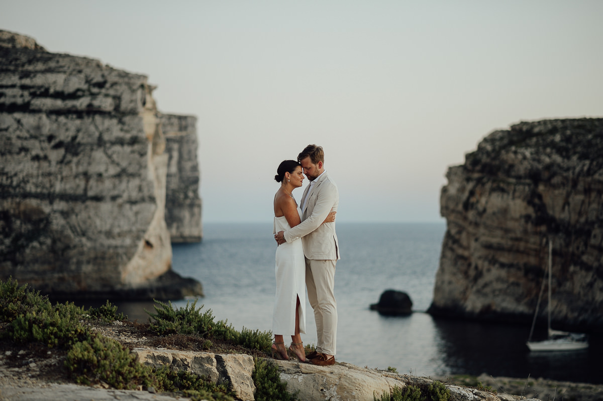 wedding couple portraits by the sea in sunset in Gozo Malta