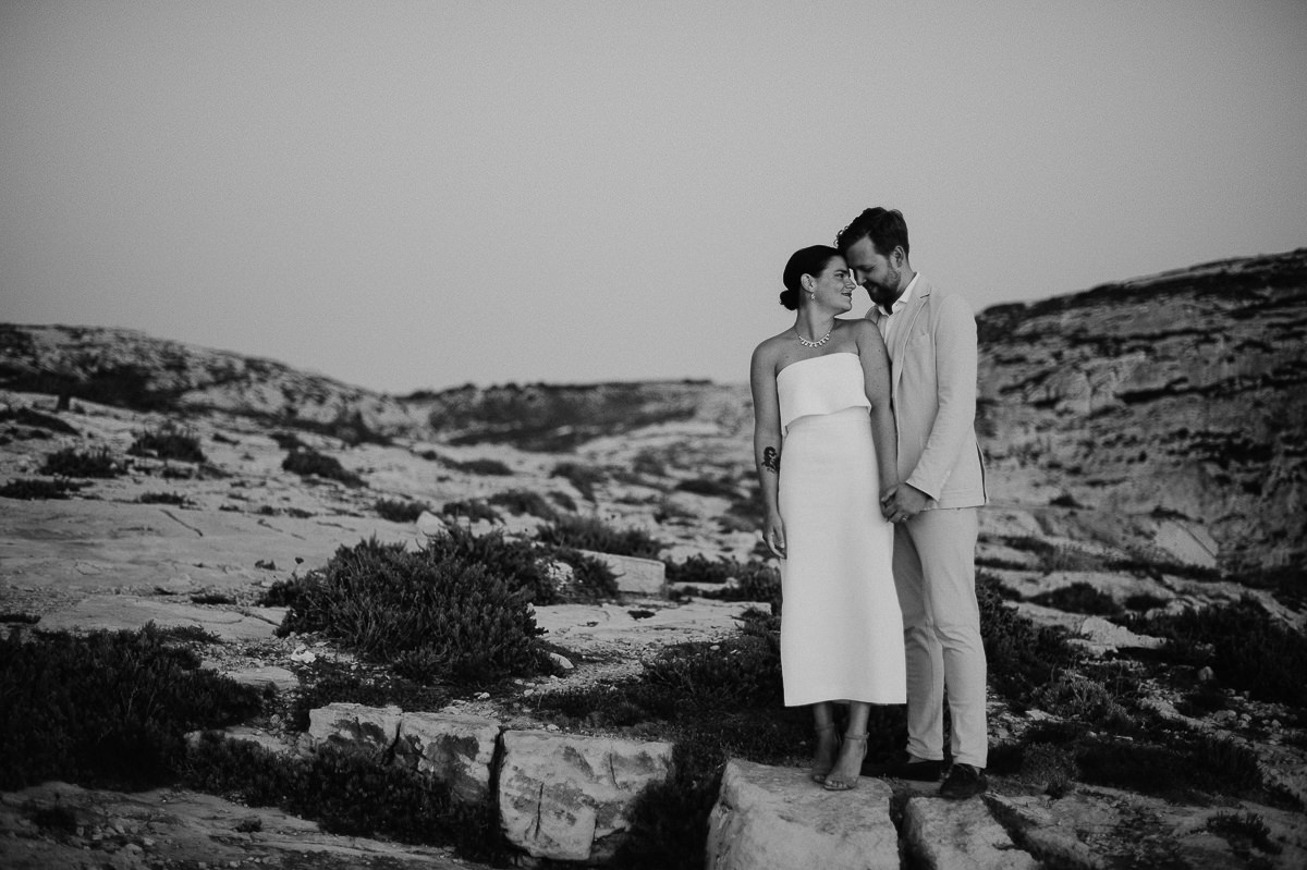 wedding couple portraits by the sea in sunset in Gozo Malta