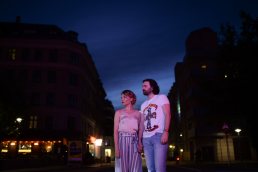couple portraits at neon light in Copenhagen meat packing district