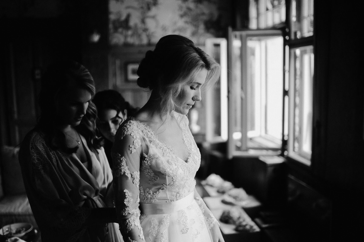 Bride getting dressed in Writer's villa