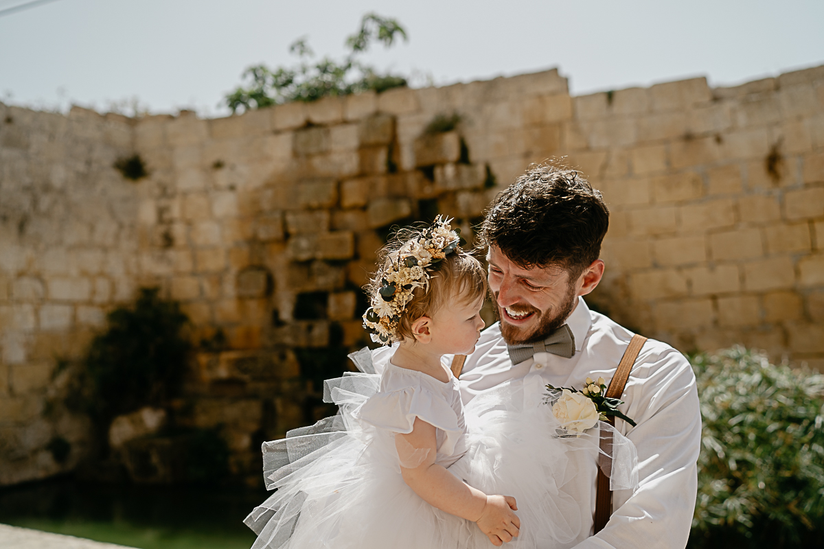 portrait of groom and baby in Ta' Cenc Hotel wedding ceremony in Gozo