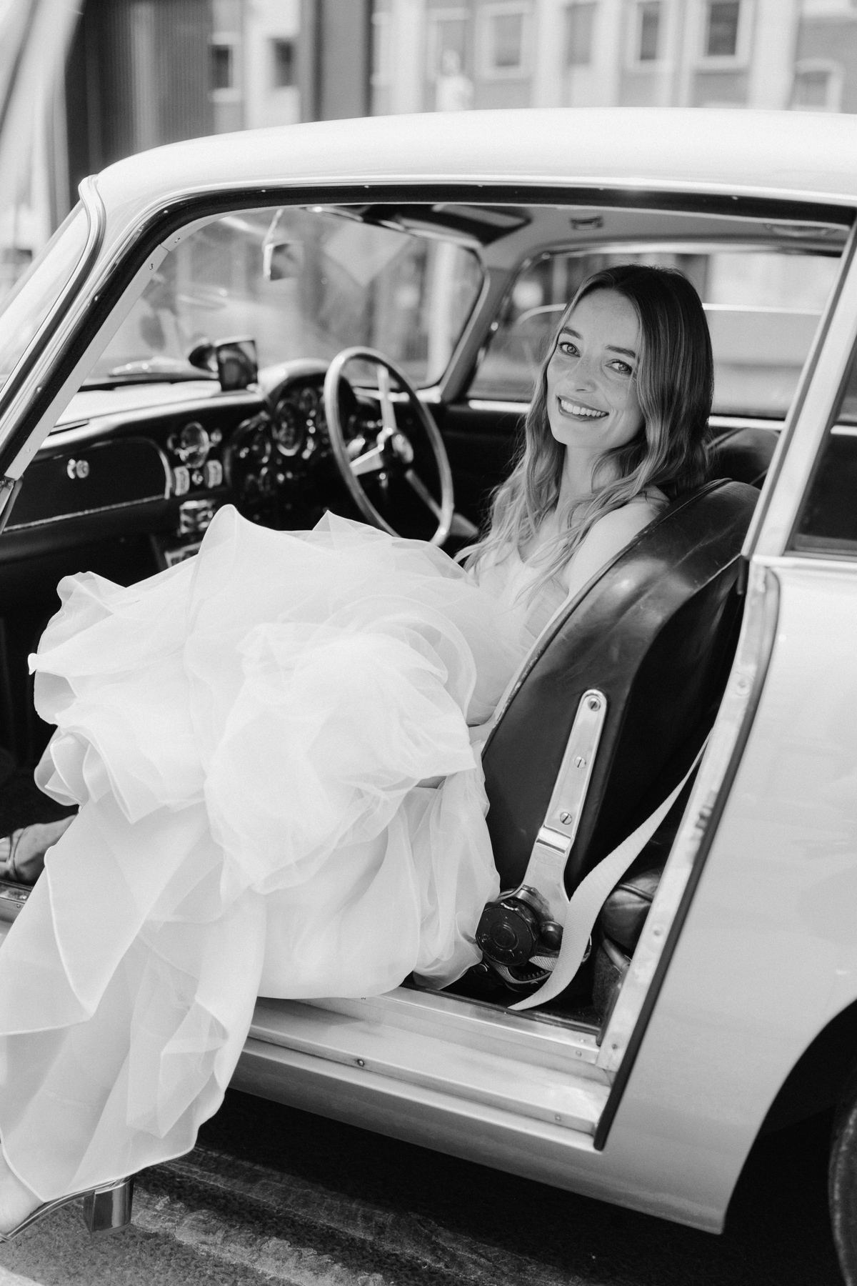 Stylish bridal portrait in London with Aston Martin DB5