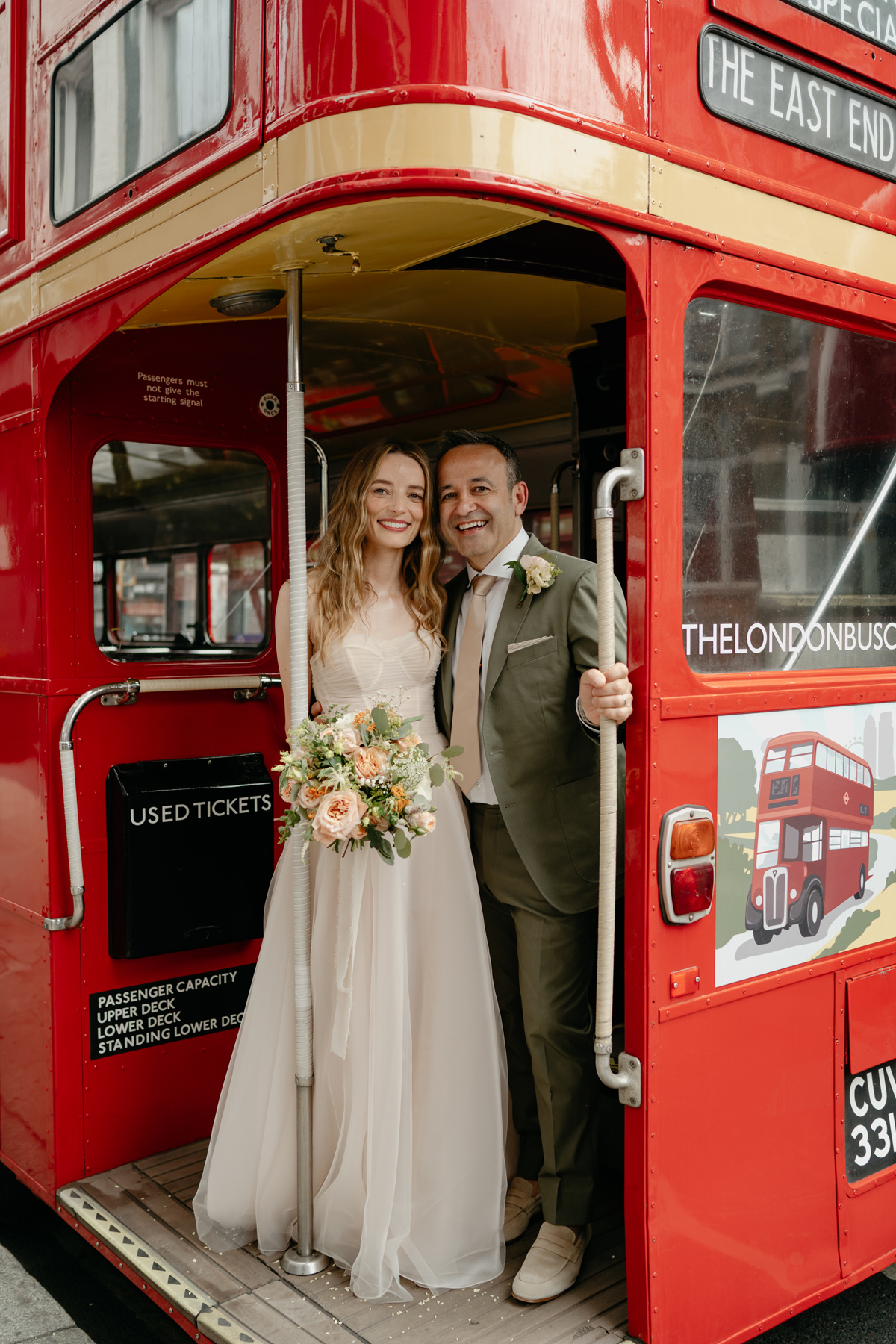 Stylish London wedding photography couple portrait with red double decker