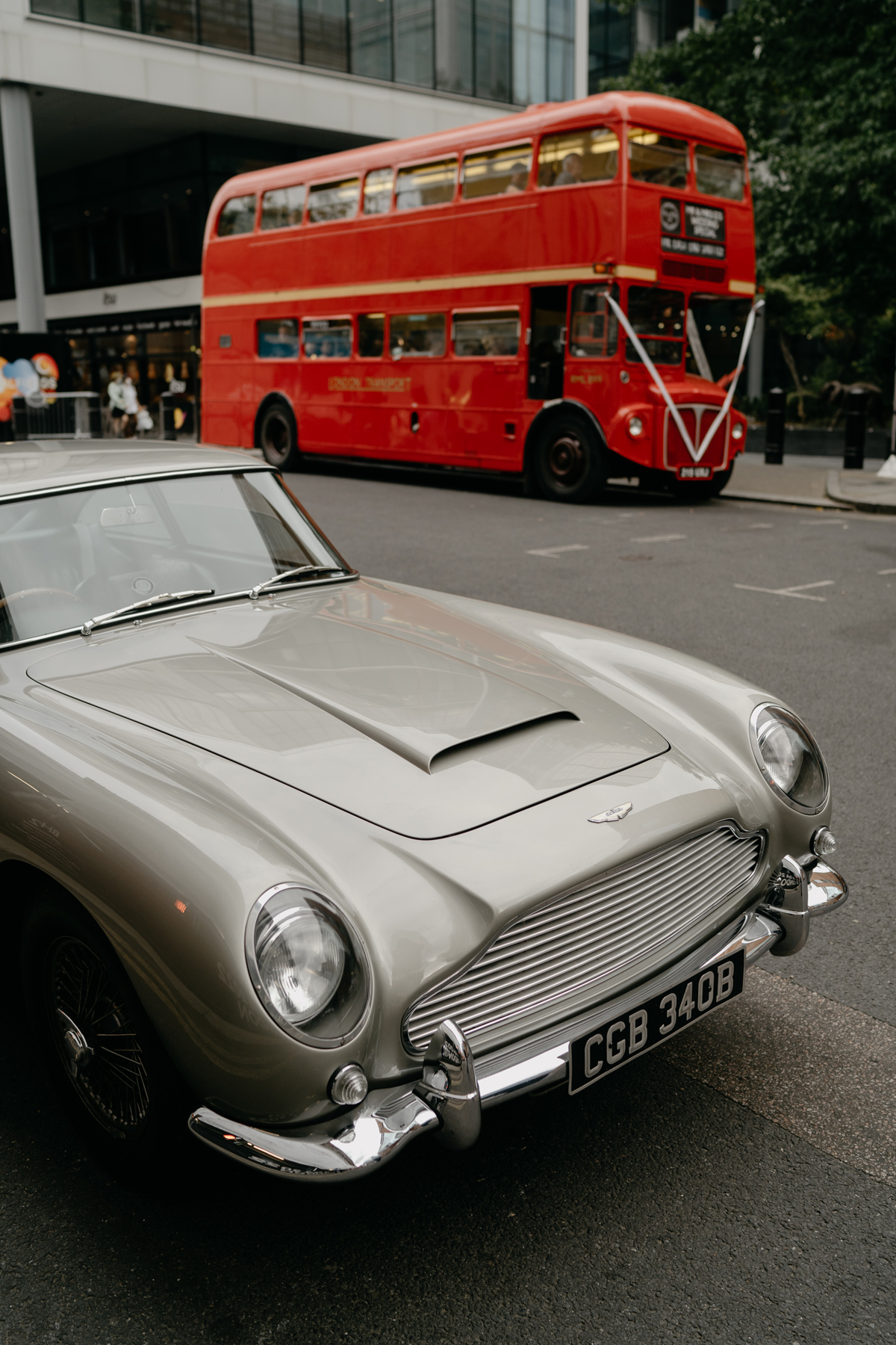 Aston Martin DB5 and red wedding double decker bus